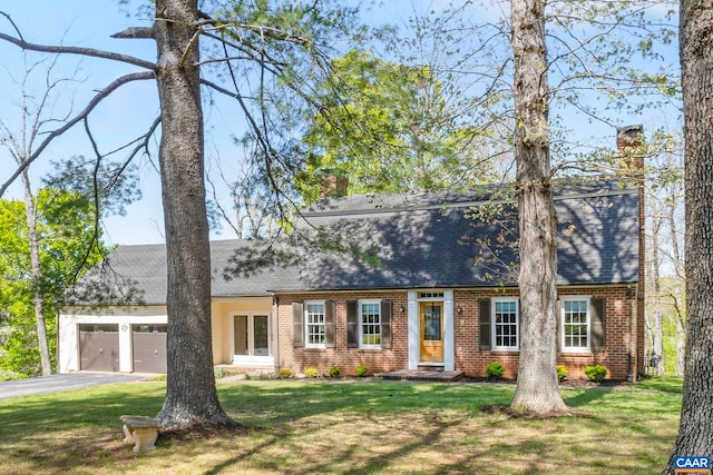 330 Carrsbrook Dr, Charlottesville, VA 22901 - view of front of house with a chimney, brick siding, a garage, asphalt driveway, and a front yard