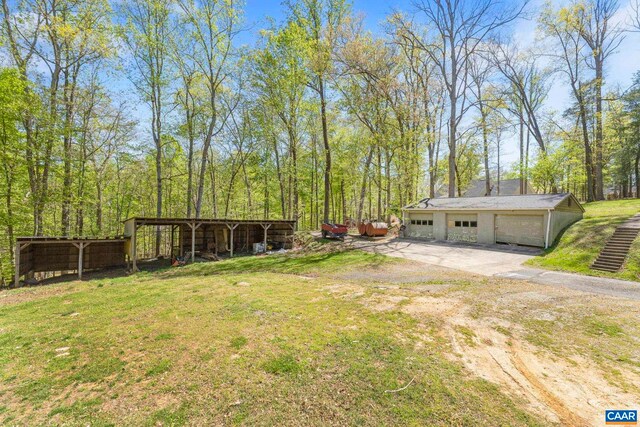 330 Carrsbrook Dr, Charlottesville, VA 22901 - view of green lawn featuring an outbuilding, a garage, and a pole building