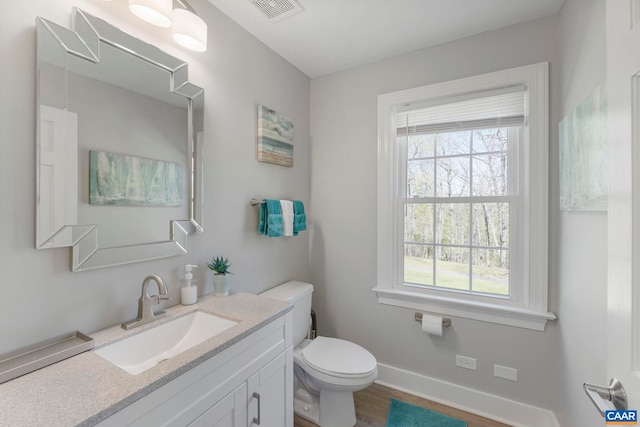 330 Carrsbrook Dr, Charlottesville, VA 22901 - half bathroom with plenty of natural light, wood finished floors, toilet, and baseboards