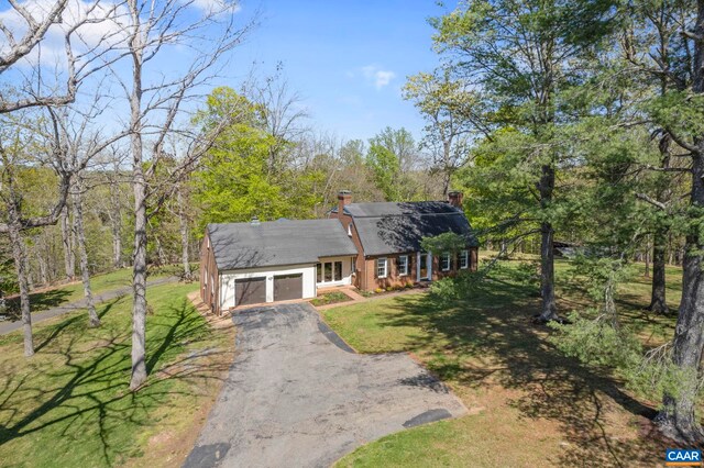 330 Carrsbrook Dr, Charlottesville, VA 22901 - view of front of home with driveway, an attached garage, a chimney, and a front yard