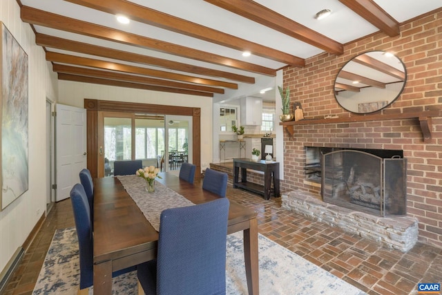330 Carrsbrook Dr, Charlottesville, VA 22901 - dining space with beamed ceiling, a brick fireplace, brick floors, and baseboards