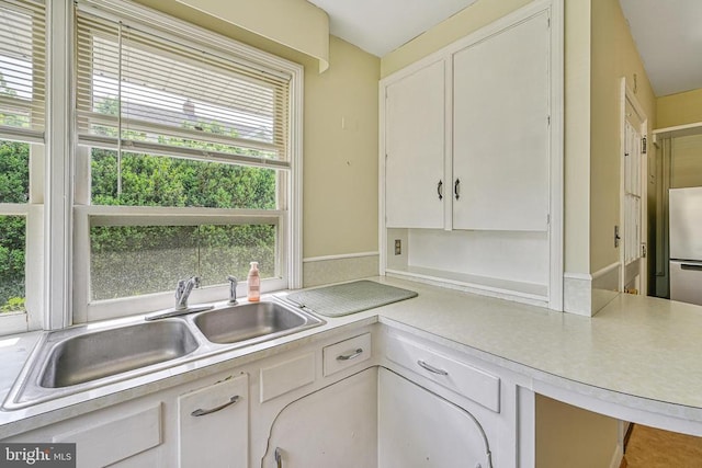 102 Washington St E, Remington, VA 22734 - kitchen featuring a sink, light countertops, and healthy amount of natural light