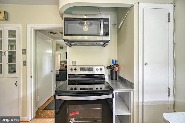 102 Washington St E, Remington, VA 22734 - kitchen with electric range oven, stainless steel microwave, and stainless steel counters