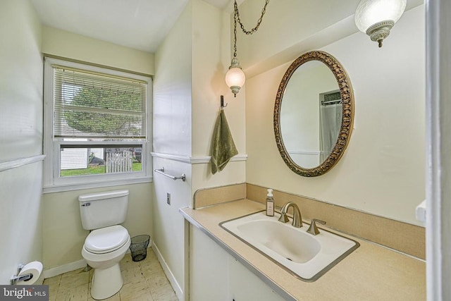 102 Washington St E, Remington, VA 22734 - bathroom featuring toilet, vanity, and baseboards