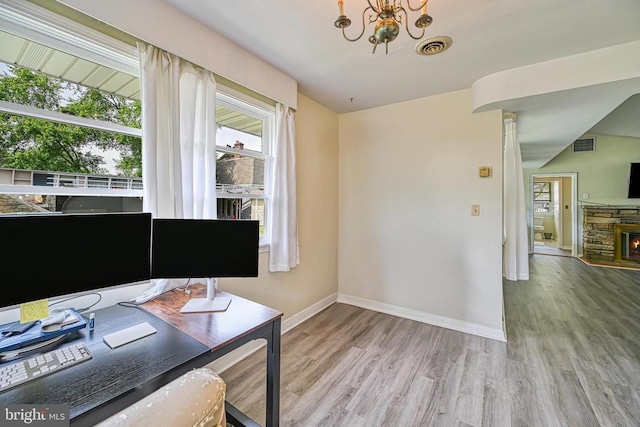 102 Washington St E, Remington, VA 22734 - office area featuring wood finished floors, healthy amount of natural light, a chandelier, and baseboards