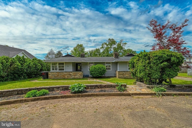 102 Washington St E, Remington, VA 22734 - ranch-style house featuring stone siding, a front lawn, and a chimney