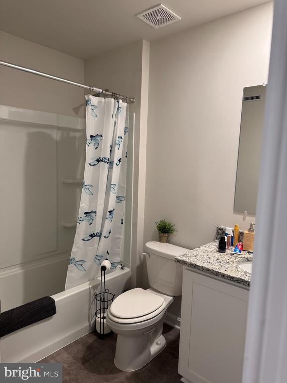 182 Allison Dr, Luray, VA 22835 - full bathroom featuring shower / bath combination with curtain, toilet, and vanity