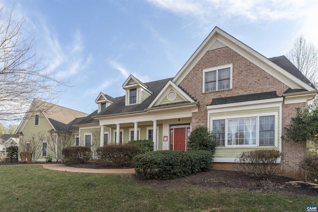 1330 Elderberry Pl, Earlysville, VA 22936 - view of front of property with brick siding, a front yard, and roof with shingles