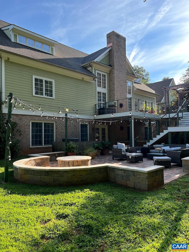 1330 Elderberry Pl, Earlysville, VA 22936 - back of property featuring an outdoor living space with a fire pit, a patio area, a yard, and brick siding