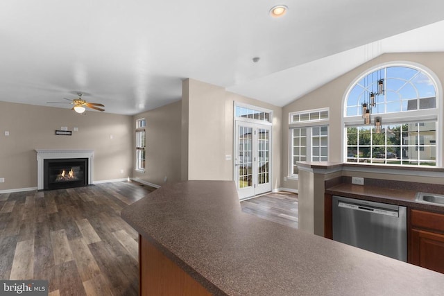 12190 Remland Ct, Remington, VA 22734 - kitchen with dishwasher, dark wood finished floors, dark countertops, ceiling fan, and a glass covered fireplace