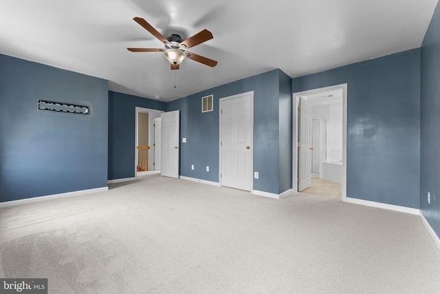 12190 Remland Ct, Remington, VA 22734 - unfurnished bedroom with light colored carpet, a ceiling fan, and ensuite bath