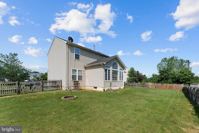 12190 Remland Ct, Remington, VA 22734 - back of property with a fenced backyard, a fire pit, and crawl space