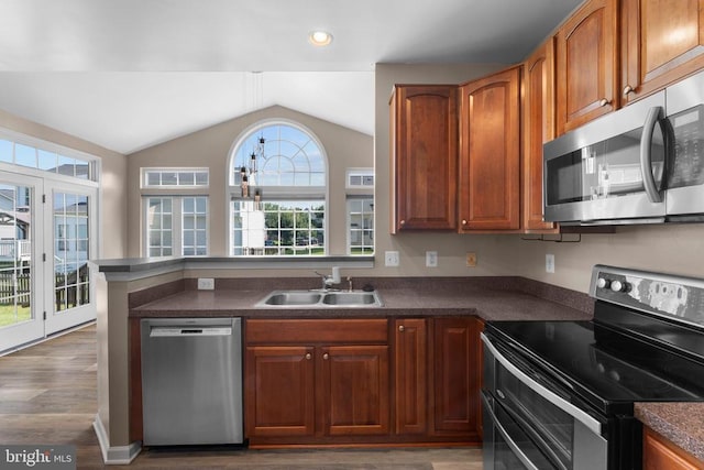 12190 Remland Ct, Remington, VA 22734 - kitchen with stainless steel appliances, lofted ceiling, dark countertops, healthy amount of natural light, and recessed lighting