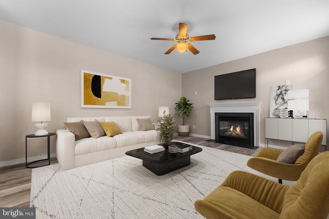 12190 Remland Ct, Remington, VA 22734 - living area featuring wood finished floors, a ceiling fan, and a fireplace with flush hearth