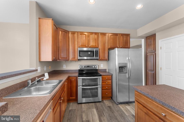 12190 Remland Ct, Remington, VA 22734 - kitchen featuring stainless steel appliances, dark wood-type flooring, recessed lighting, dark countertops, and brown cabinetry