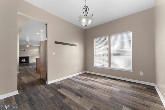 12190 Remland Ct, Remington, VA 22734 - spare room with a ceiling fan, dark wood finished floors, and a lit fireplace