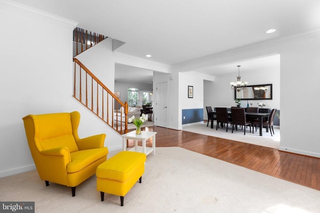 9016 Laurel Oak Ln, Fredericksburg, VA 22407 - living room featuring ornamental molding, a chandelier, stairway, wood finished floors, and baseboards