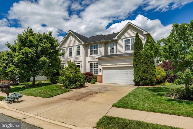 9016 Laurel Oak Ln, Fredericksburg, VA 22407 - traditional-style home featuring an attached garage, driveway, brick siding, and a front yard
