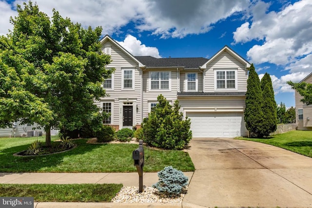 9016 Laurel Oak Ln, Fredericksburg, VA 22407 - view of front facade featuring an attached garage, concrete driveway, and a front yard