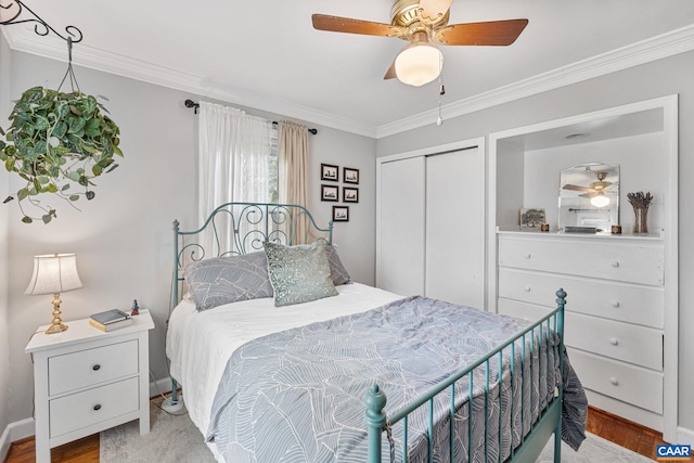 1605 Oakleaf Ln, Charlottesville, VA 22903 - bedroom with crown molding, a closet, wood finished floors, and ceiling fan