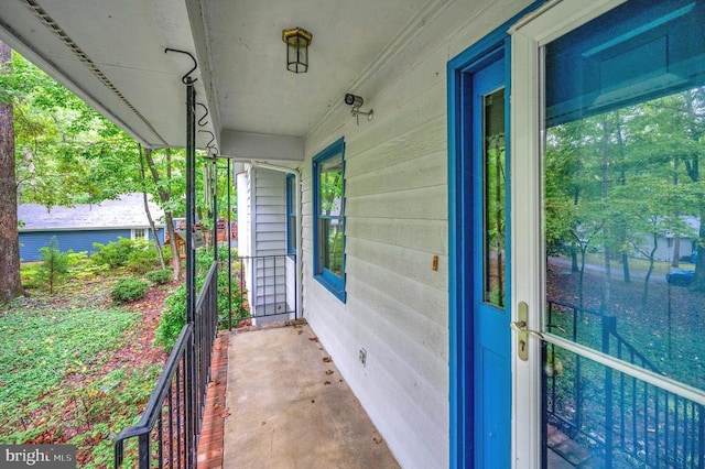 doorway to property with a porch and crawl space