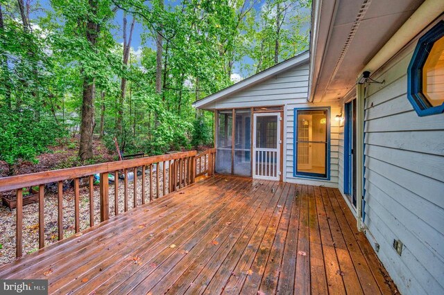 deck with a sunroom