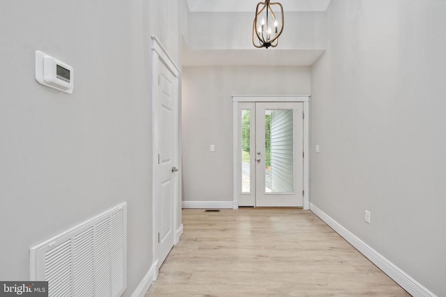 79 Hickory Cir, Mineral, VA 23117 - foyer entrance with light wood finished floors and a chandelier