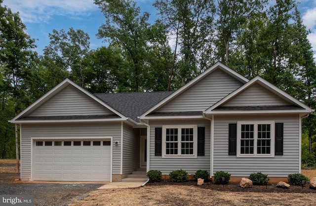 79 Hickory Cir, Mineral, VA 23117 - ranch-style home with gravel driveway, a garage, and roof with shingles