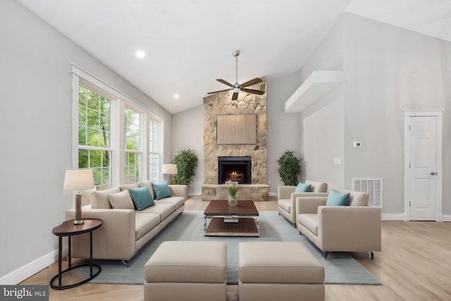 79 Hickory Cir, Mineral, VA 23117 - living area featuring a ceiling fan, lofted ceiling, a stone fireplace, and wood finished floors