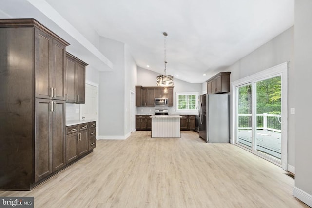 79 Hickory Cir, Mineral, VA 23117 - kitchen featuring stainless steel appliances, lofted ceiling, dark brown cabinets, light wood finished floors, and light countertops