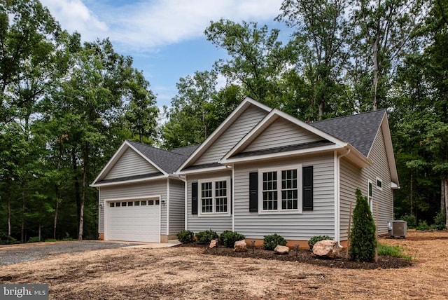 79 Hickory Cir, Mineral, VA 23117 - ranch-style house with an attached garage, gravel driveway, and a shingled roof