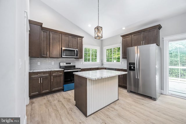 79 Hickory Cir, Mineral, VA 23117 - kitchen with appliances with stainless steel finishes, dark brown cabinets, light wood-type flooring, vaulted ceiling, and tasteful backsplash