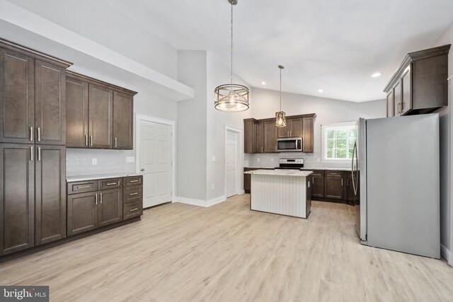 79 Hickory Cir, Mineral, VA 23117 - kitchen with freestanding refrigerator, stainless steel microwave, range with electric cooktop, backsplash, and dark brown cabinets