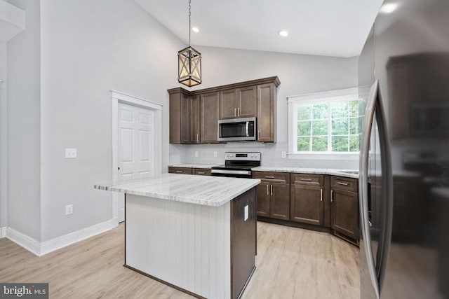 79 Hickory Cir, Mineral, VA 23117 - kitchen with stainless steel appliances, tasteful backsplash, light wood-style floors, dark brown cabinets, and high vaulted ceiling