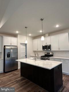 Old Lawyers Rd, Unionville, VA 22567 - kitchen featuring appliances with stainless steel finishes, backsplash, light countertops, dark wood-type flooring, and recessed lighting