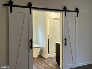 Old Lawyers Rd, Unionville, VA 22567 - bathroom with wood finished floors, baseboards, and a shower stall