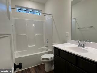 Old Lawyers Rd, Unionville, VA 22567 - bathroom with toilet, wood finished floors, vanity, and  shower combination