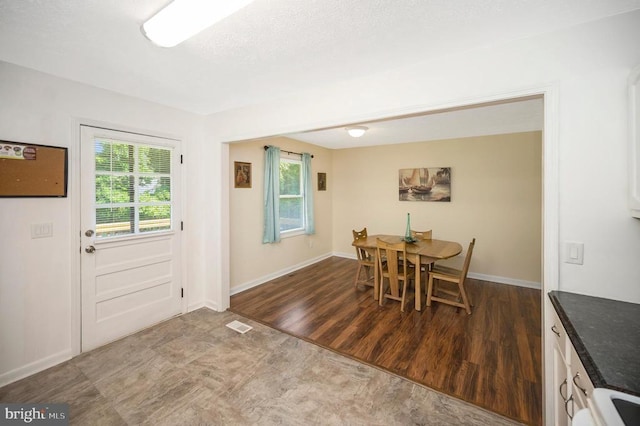 1406 Lakeview Pkwy, Locust Grove, VA 22508 - dining area with healthy amount of natural light and dark wood-style floors