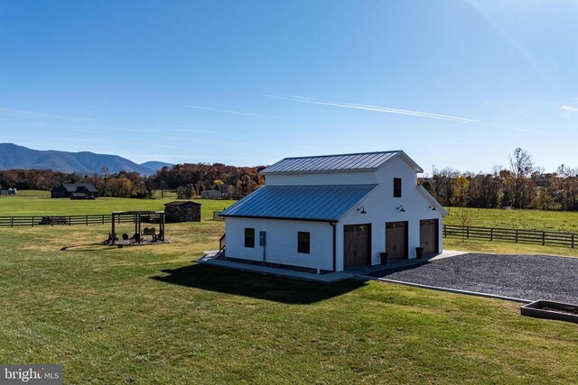 1246 Whispering Hill Rd, Luray, VA 22835 - view of side of property featuring an outbuilding, a garage, a mountain view, a view of countryside, and metal roof
