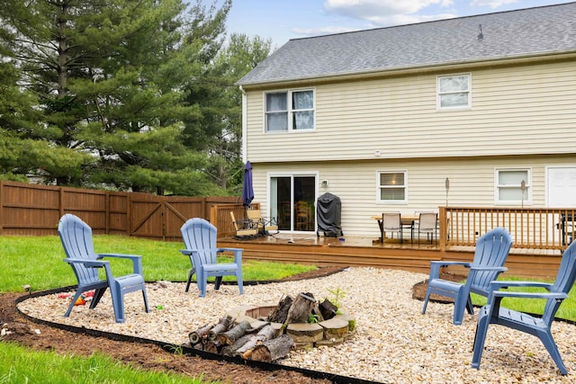 701 Horseshoe Cir, Stuarts Draft, VA 24477 - back of property with a fire pit, a fenced backyard, and a deck