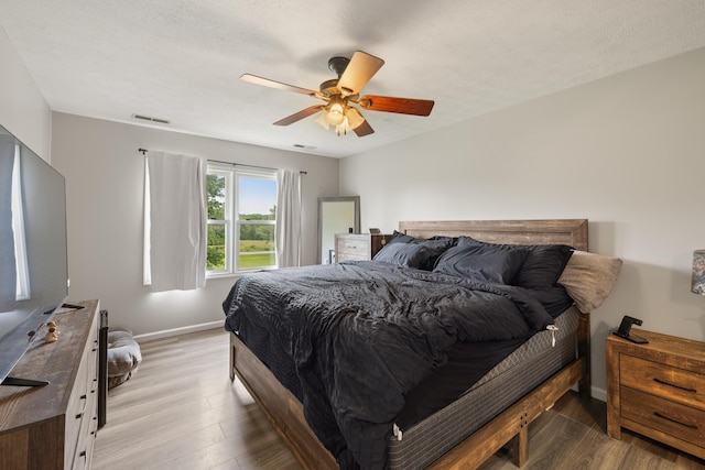 701 Horseshoe Cir, Stuarts Draft, VA 24477 - bedroom with light wood finished floors, baseboards, and ceiling fan