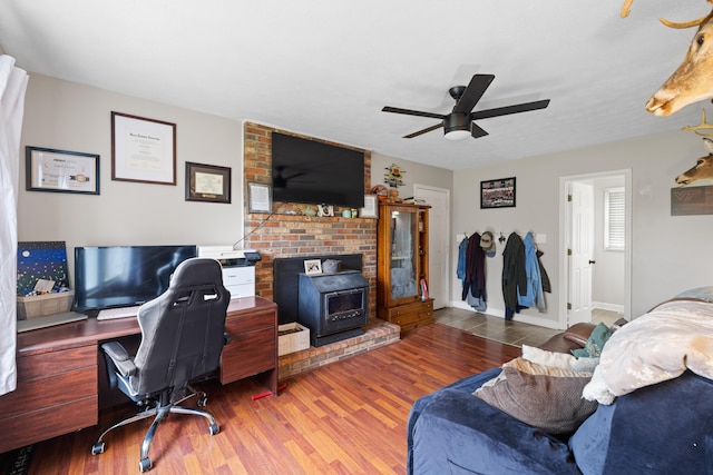 701 Horseshoe Cir, Stuarts Draft, VA 24477 - office space with a wood stove, ceiling fan, wood finished floors, and baseboards