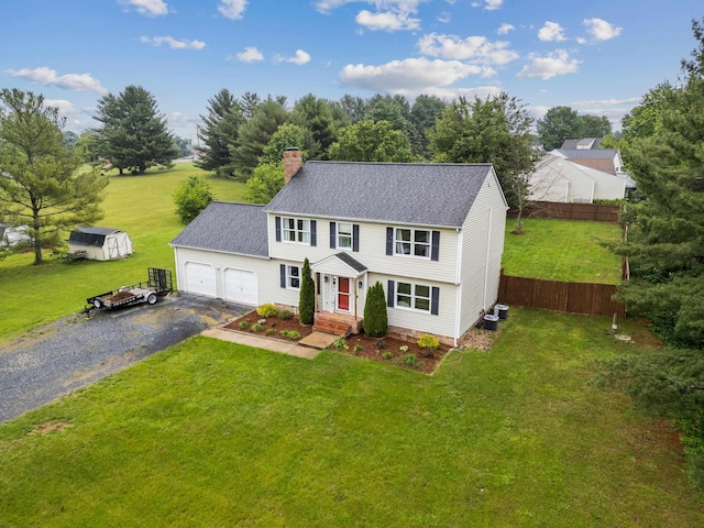 701 Horseshoe Cir, Stuarts Draft, VA 24477 - colonial home with asphalt driveway, an attached garage, a chimney, and roof with shingles