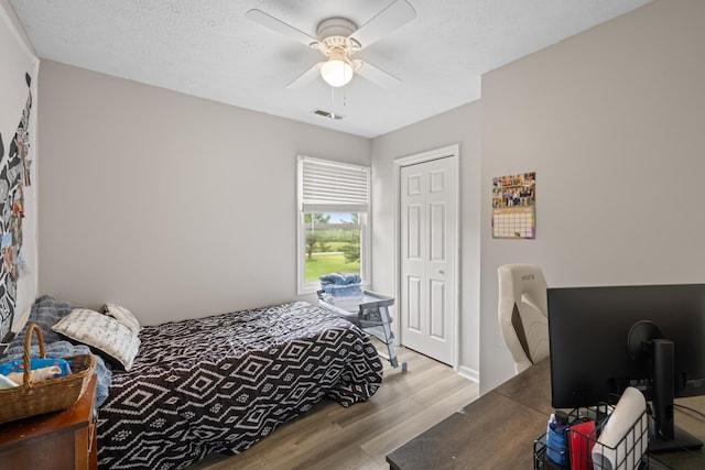 701 Horseshoe Cir, Stuarts Draft, VA 24477 - bedroom featuring wood finished floors, a ceiling fan, and a closet