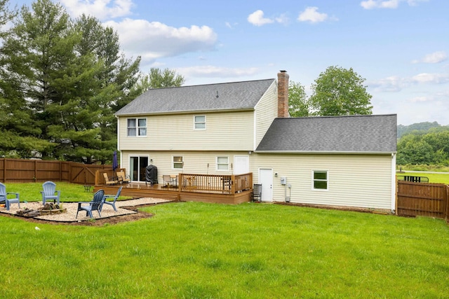 701 Horseshoe Cir, Stuarts Draft, VA 24477 - back of property with a fire pit, a deck, a chimney, and roof with shingles