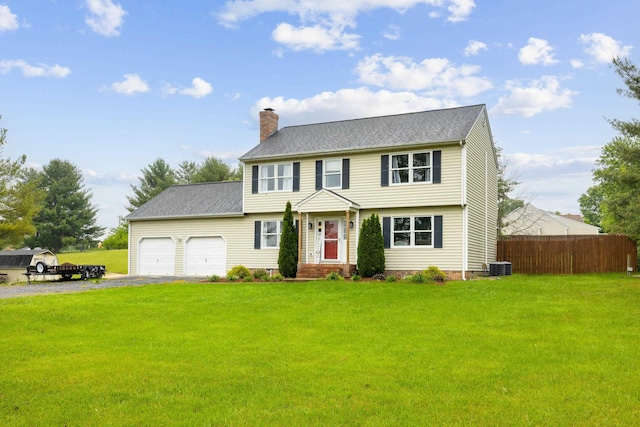 701 Horseshoe Cir, Stuarts Draft, VA 24477 - colonial home featuring a chimney, central AC unit, driveway, and a garage