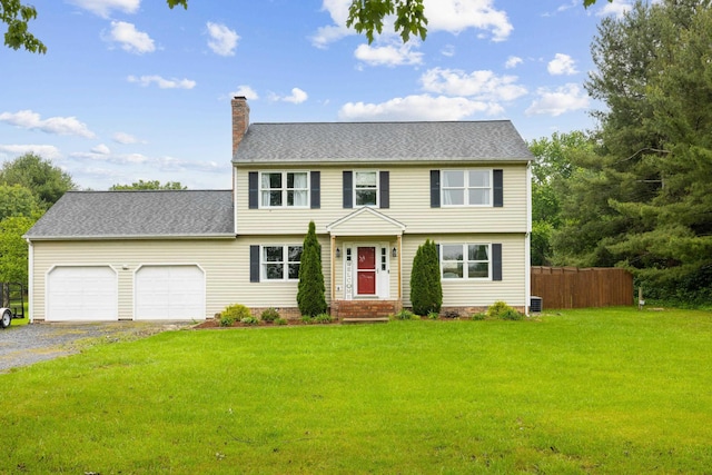 701 Horseshoe Cir, Stuarts Draft, VA 24477 - colonial inspired home featuring a chimney, a garage, gravel driveway, and central AC unit