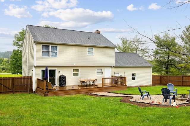 701 Horseshoe Cir, Stuarts Draft, VA 24477 - rear view of property featuring an outdoor fire pit, a wooden deck, a chimney, and a shingled roof