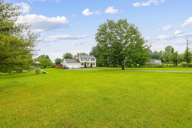 701 Horseshoe Cir, Stuarts Draft, VA 24477 - view of grassy yard with driveway and an attached garage