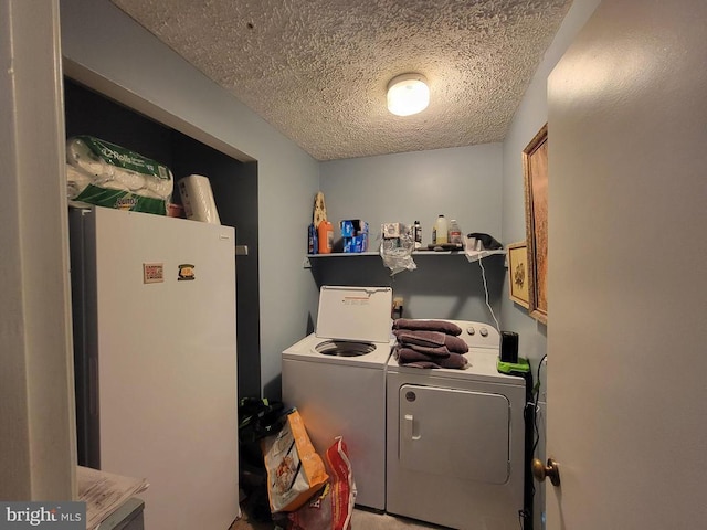 216 Wakefield Dr, Locust Grove, VA 22508 - washroom featuring washer and clothes dryer and a textured ceiling